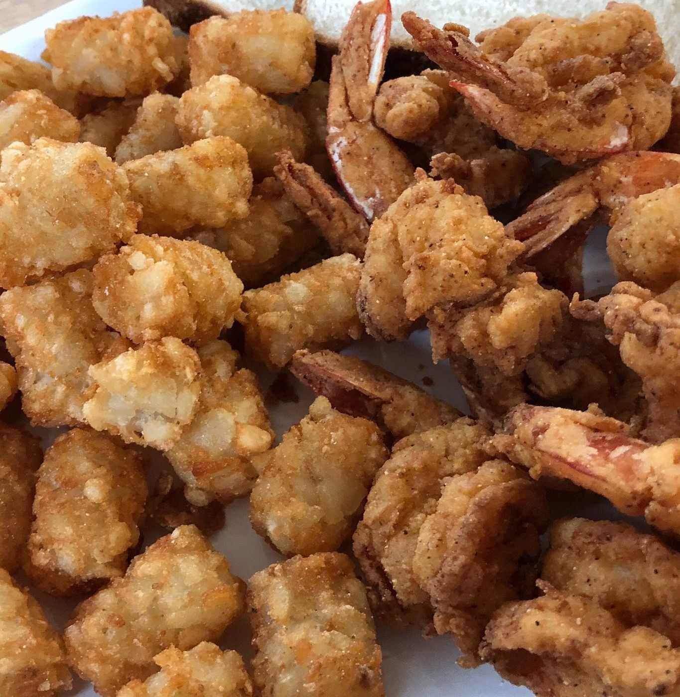 Fried shrimp piled with tater tots