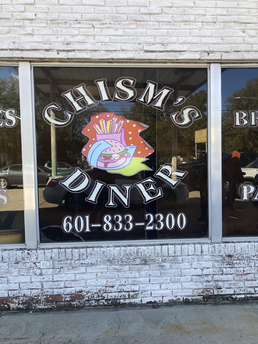 Close-up of the front window: CHISM'S DINER lettering around a burger-and-fries logo, with the phone number 601-833-2300